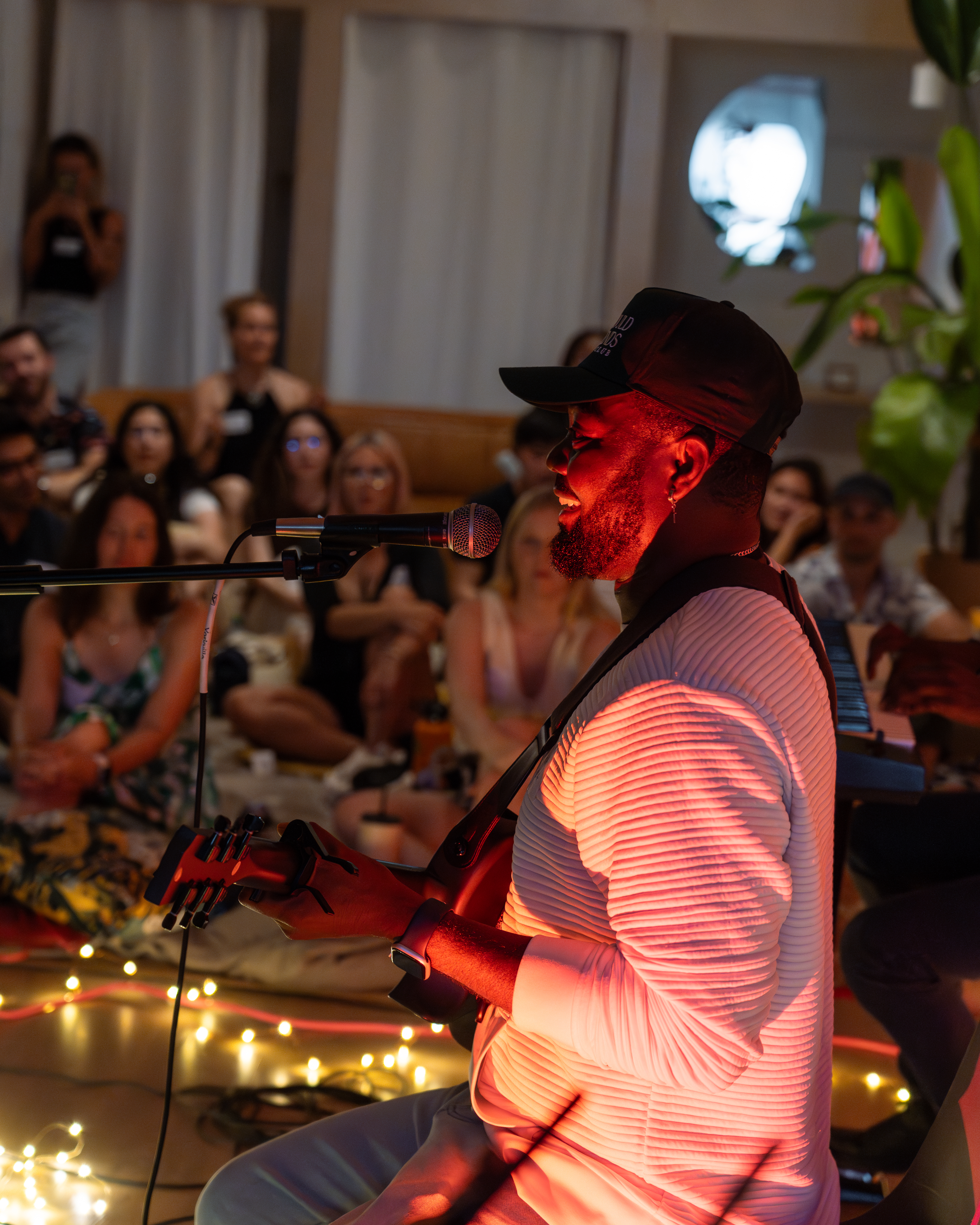 Man playing guitar and smiling